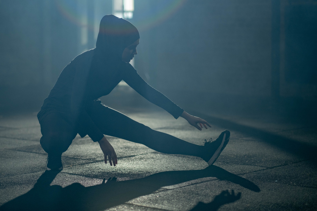 Woman in Black Activewear Exercising